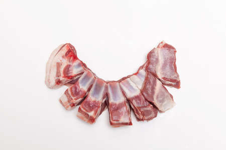Lamb ribs for grilling or pilaf on a light background with copy space.の写真素材