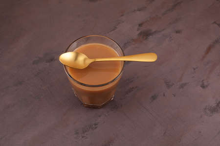 Karak tea or Masala chai. Popular Indian warming drink. Is prepared with the addition of milk,...