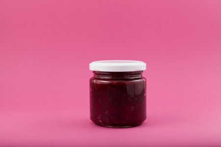 Fried or stewed beets in jar. Delicious ingredient for vegetarian salads or borscht.の写真素材