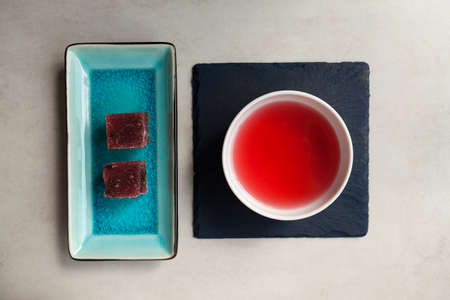 Schizandra tea and fruits marmalade, top view. Traditional ancient Korean drink is brewed from Chinese lemongrass berries. Used in alternative medicine.の写真素材