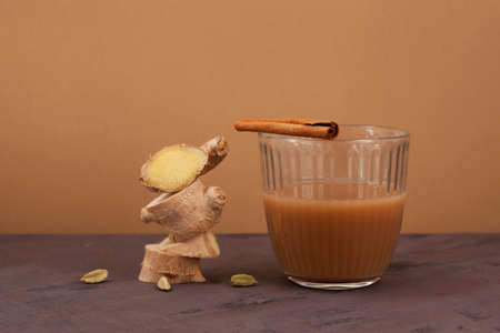Teh halia - ginger tea in Brunei, Malaysia and Singapore cuisines. It is brewed of strong sweetened black tea with milk or condensed milk. Selective focus, copy space.の写真素材
