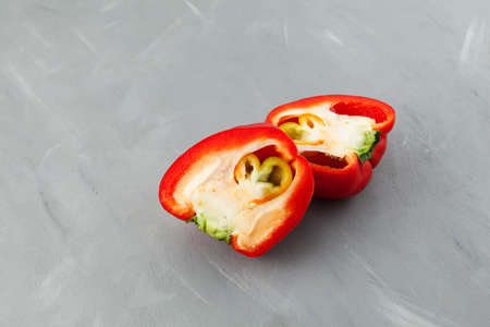 Ugly double pepper, cut into two halves. Inside fruit grows in shape of heart. Selective focus. Fun vegetable concept for Valentine's Day.の写真素材