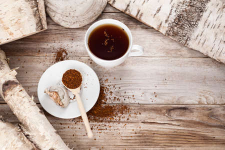 Cup of Chaga tea, Healthy natural drink. Natural antioxidant. Prepared from dried birch mushroom....