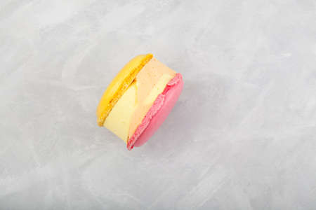 Mango passion fruit ice cream with macaroons on light background. Selective focus, copy space.の写真素材