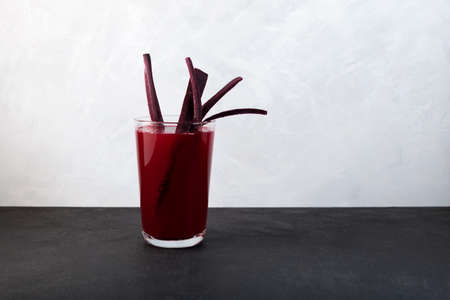 Salgam or fermented beet juice. Popular Turkish drink. Traditional beverage made with water, purple carrot or turnip (juice). Selective focus, space for text.の写真素材