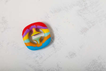 New popular multi-colored rubber toy. Funny expander with suction cup, push and clap.