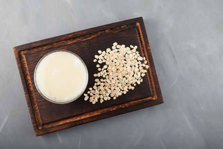 Oat milk - fresh organic and vegetarian non dairy alternative milk. Top view, selective focus.の写真素材