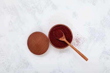 Sumac is tangy crimson spice used as a spice in Middle Eastern cuisine to add tart, lemony taste to salads or meat.の写真素材