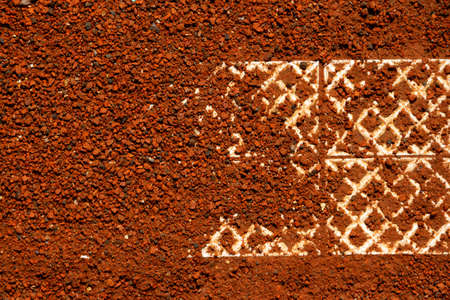 Fragment marking line of an outdoor clay tennis court. Close-up, copy space. Design element