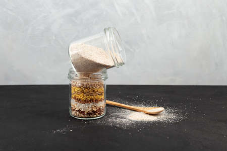 Roasted Multigrain powder in glass jar for making traditional Korean Misutgaru Latte Drink. Selective focus, copy space.の写真素材