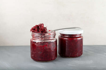Fried beets in glass jars. Delicious ingredient for vegetarian salads or borscht. Stewed beetroot.