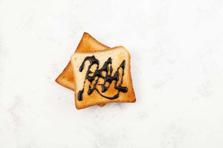Breakfast toast with spread or pasta, top view. Toasted slices of wheat bread.の写真素材