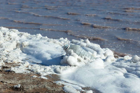 Disposable plastic household waste in the sea. Pollution of water bodies, poor ecological situation....