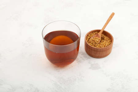 Helba or golden tea made of fenugreek. selective focus. Methi Dana drink used in local medicine of Egypt and as cooking ingredient in India.の写真素材