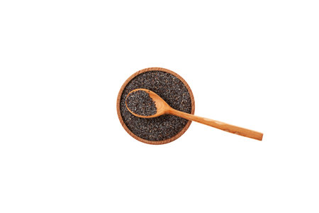 Blue poppy seeds in wooden bowl on white background, top view. Delicious Food ingredient, used in culinary. design element.の写真素材