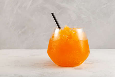 Orange Slushie drink. Sweet Shaved ice. Spanish fruit granizado. Refreshing summer iced drink.の写真素材