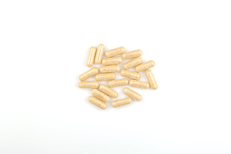 Heap Hulbah pills on white background. herbal nutritional supplements. Hulbah pills help reduce...