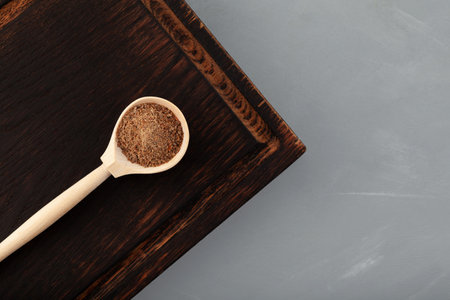 Pomace Milk Thistle in wooden spoon, top view. Silybum marianum extract, press cake. strong antioxidant. Herbal superfood for aiding liver function.の写真素材