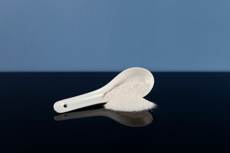 Food additive E407 or E407a in ceramic spoon. Carrageenan is Refined Kappa Carrageenan derived from Euchema Cottoni and similar species.の写真素材