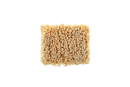 Dry pressed instant noodles on white background. Ramen noodles.の写真素材