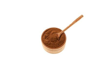 Instant chicory powder in wooden bowl isolated on white background. Dried Root chicory or Cichorium intybus used as coffee substitute. Healthy food and drinks.の写真素材