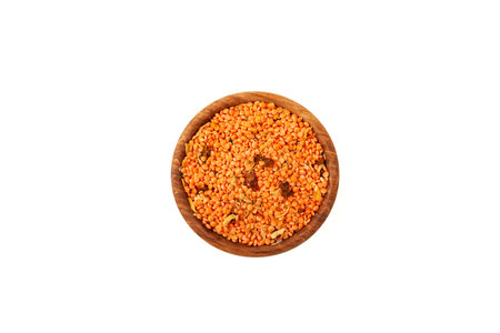 Dried Red Lentil with spicy spices in wooden bowl on white, top view. Masurdal or Dal. Mix of Uncooked ingredients for soup-mashed with curry. Dry legumes. Long-term storage Healthy Food.の写真素材