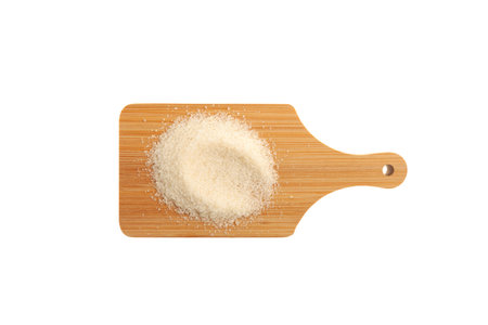 Gelatin granulated or gelatin powder on cutting board isolated on white background. Food additive E441, Hydrolyzed collagen used for will form a jelly or gel naturally.の写真素材