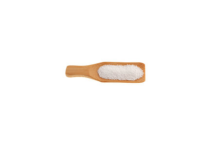 Sodium benzoate, sodium salt of benzoic acid in wooden scoop. White crystalline powder, C6H5COONa. Food additive E211, Preservative. It has a strong depressing effect on yeast and mold fungi.の写真素材