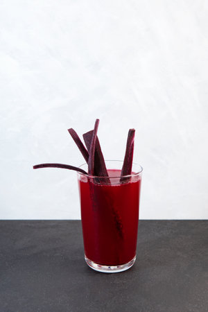 Salgam, Popular Turkish drink. Traditional beverage made with water, purple carrot or turnip (juice). Glass of fermented beet juice. natural probiotic drink.の写真素材