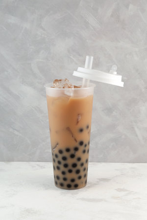 Boba drink or Bubble milk tea in tall plastic cup. Bubble milk tea. Disposable plastic take away cup.の写真素材