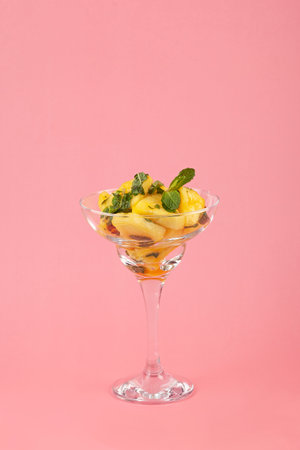 Pineapple with mint, sweet fruit dessert. Fresh pineapple slices in sugar syrup with mint leaves. Traditional Asian dessert.の写真素材