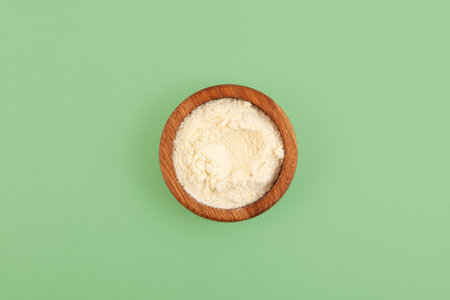 Food additive E234 in wooden bowl, top view. Nisin powder inhibits yeast growth, effective drug against mold, does not affect the taste characteristics.の写真素材