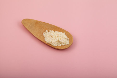 Nisin powder in scoop. Food additive E234 used in medicine, food industry, in veterinary medicine as antibiotic. Nisin extended shelf life, suppressing reproduction of pathogenic bacteria.の写真素材