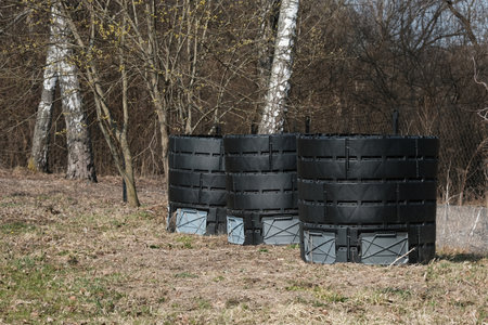 Waste containers with organic biodegradable food waste and vegetable leftovers, garden compost pit for making compost. plastic compost bin.の写真素材