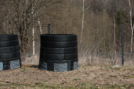 Plastic compost bins black color. Modern compost pit. biodegradable garbage. Reduce organic food waste. Concept Zero Waste. Rural scene.の写真素材