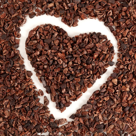 Pile of Cacao nibs, close-up. Crunchy pieces of peeled, crushed and lightly roasted cocoa beans with pleasant chocolate bitterness. Sugar-free product, Natural antidepressant.の写真素材