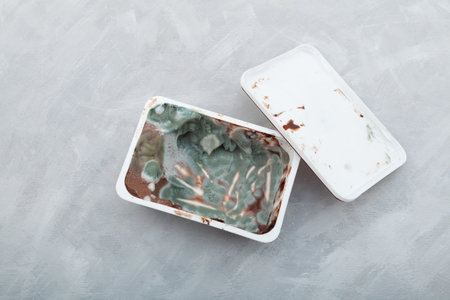Terrible expired food. Chocolate peanut paste or spread for breakfast with mold in plastic...