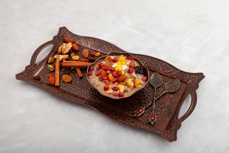 Traditional Turkish Dessert Ashure on metal serving dish. Sweet delicious pudding also called as Noah's pudding or Noah's Dessert. Alternative names Ashura, anusabur, ashour.の写真素材