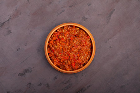 Chili con carne in ceramic bowl, top view. Tex-mex food. Traditional Mexican spicy dish with red beans, peppers, tomatoes and minced meat.の写真素材