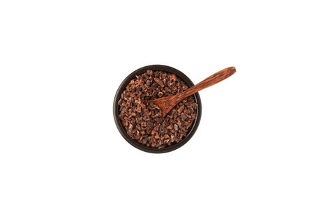 Cocoa nibs. Crunchy pieces of peeled, crushed and lightly roasted cocoa beans with pleasant chocolate bitterness. Cacao Nibs are packed with mood- and energy-boosting nutrients.の写真素材