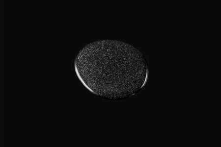 Guar Gum liquid with bubbles on dark surface. Food additive E412. Natural thickener.の写真素材