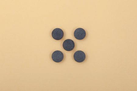 Indigotine pigments in tablets. Dye or Food additive E132 used for coloring food products, drinks...