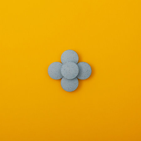 Light blue pigments in tablets on yellow background. Dyes or Food additives for coloring food products, and also decorating Easter eggs.の写真素材