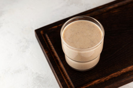Milkshake with dates or palm fruits and roasted multi grain powder. Refreshing nutritious drink. Energy protein smoothie. Popular protein cocktail to energy while fasting.の写真素材