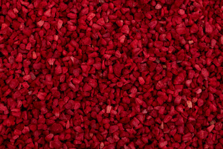 Heap of freeze dried raspberries nibs, close-up. Dehydrated raspberry. Dried red berries. Very popular fruit cereal supplement for children.の写真素材