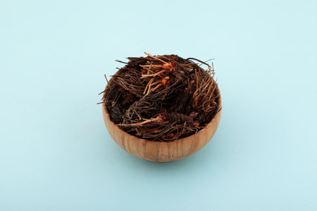 Dried Rhodiola quadrifida or Red brush plant, also called as Siberian ginseng in wooden bowl. Rhizomes with roots are used in folk medicine as a tonic and stimulant.の写真素材