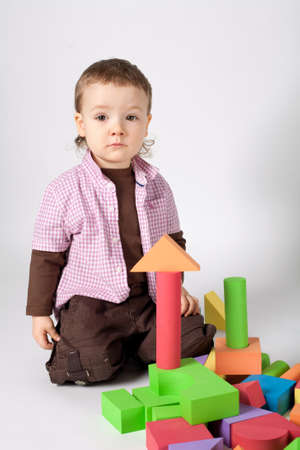 little cute boy plays with cubesの写真素材