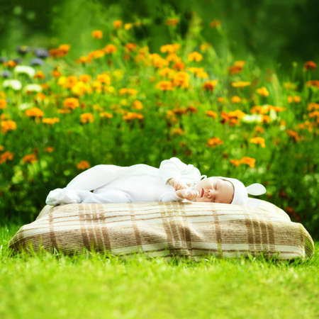 sweet sleeping baby with rabbit costumeの写真素材