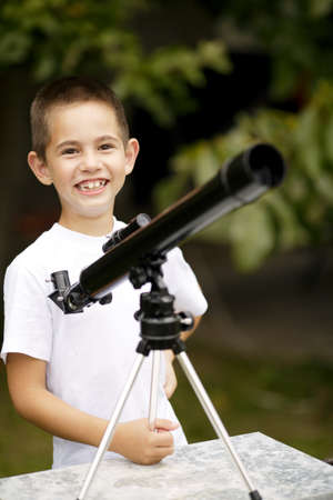 little boy with telescope