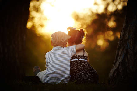 boy and girl on sunsetの写真素材